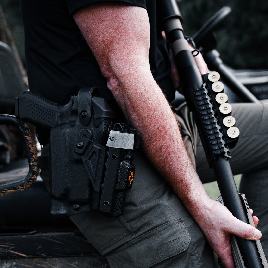 Pistol holster mount for tourniquet carrier. Tourniquet mounting bracket for Safariland SLS / ALS holsters. Red dot and non-red dot sight models. Eleven 10 RIGID TQ Case Holster Mount.